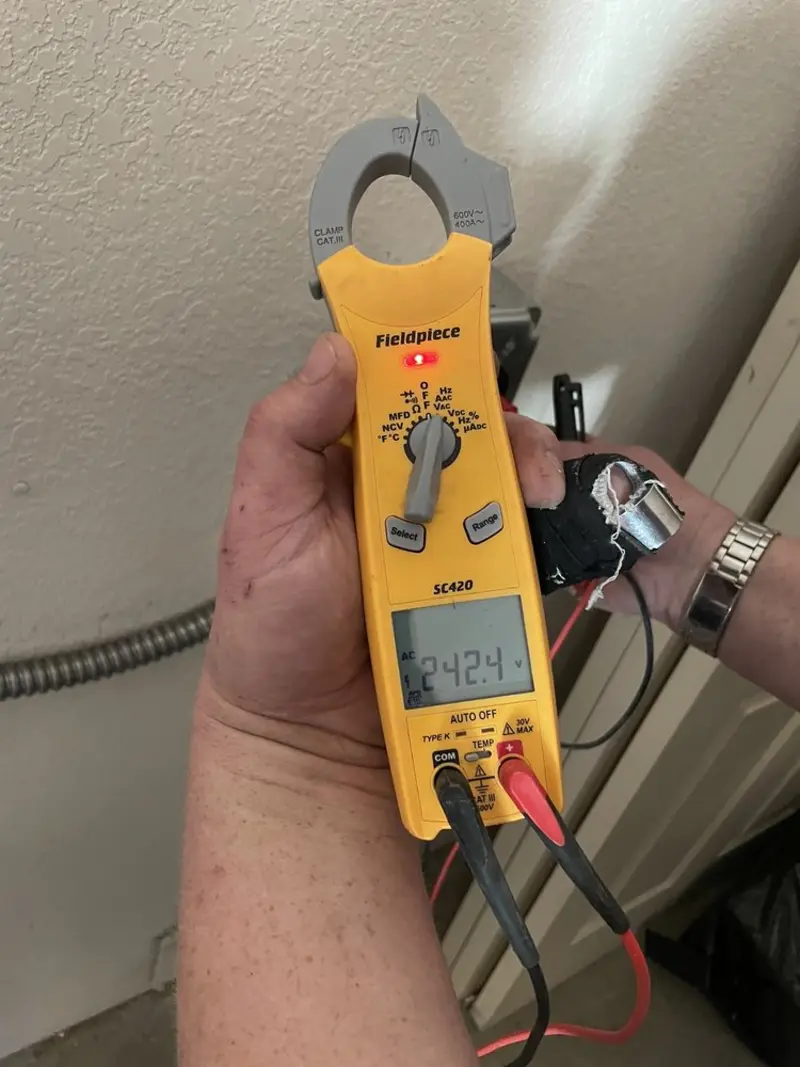 Voltage testing with clamp meter during Recessed Lighting Installation in Dana Point